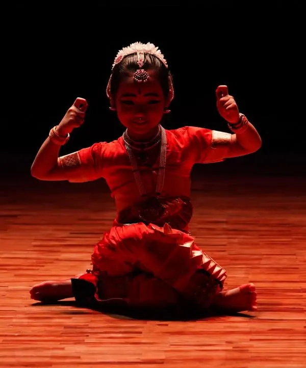 Even my youngest students learn the power of Abhinaya. Here, a little dancer sits in the Aramandi posture, her expression full of confidence and character.