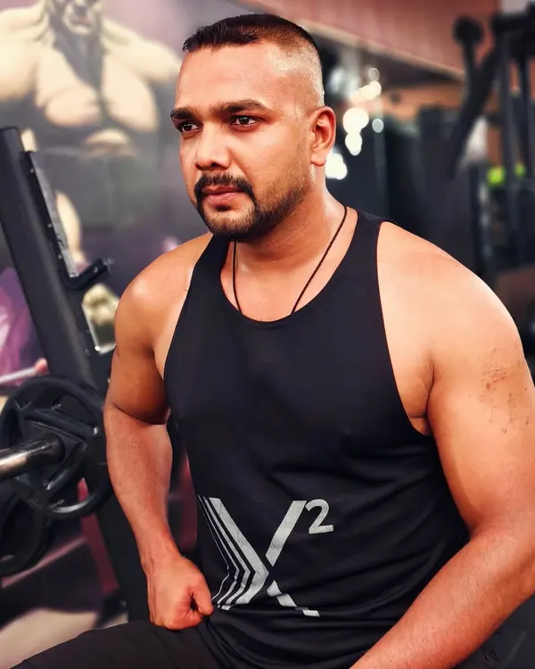 A moment of focus at the gym. My own fitness journey is ongoing, and it fuels my passion for coaching.