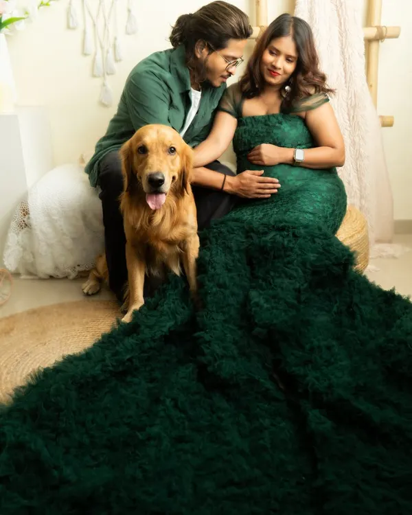 A dramatic maternity portrait with an expecting couple and their golden retriever. I love including pets in photoshoots, and this session shows how we can create a beautiful family portrait with everyone involved.