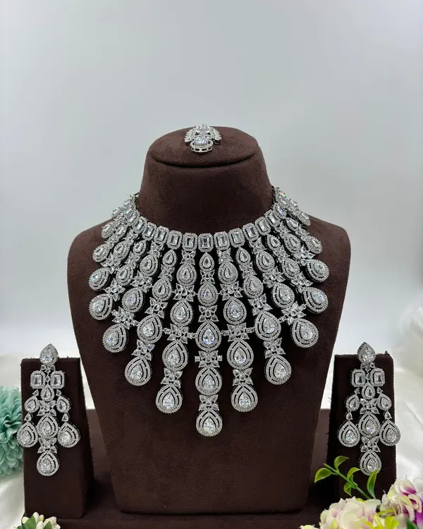 A grand, cascading necklace made with brilliant-cut American Diamonds. This is a showstopper piece, perfect for a reception gown or a modern saree.