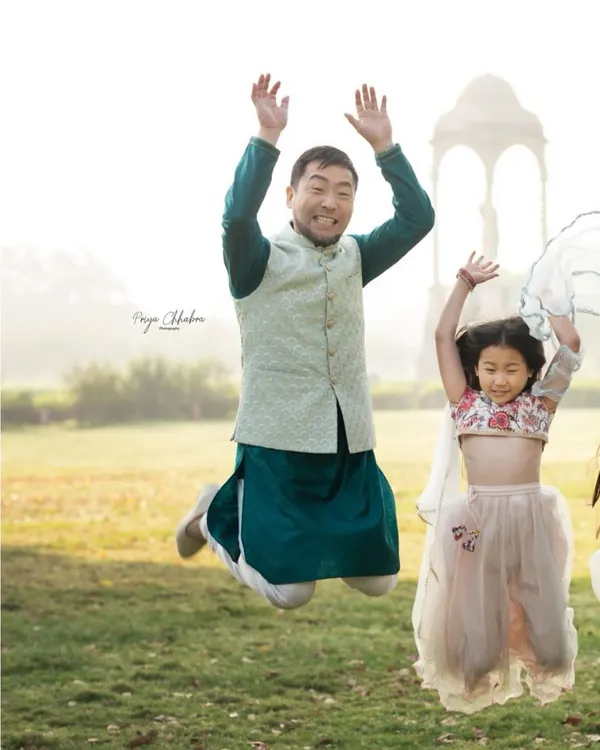 Pure, jumping-for-joy happiness! An outdoor family shoot in a Delhi park is the perfect place to let loose and capture energetic, fun-filled moments like this one.