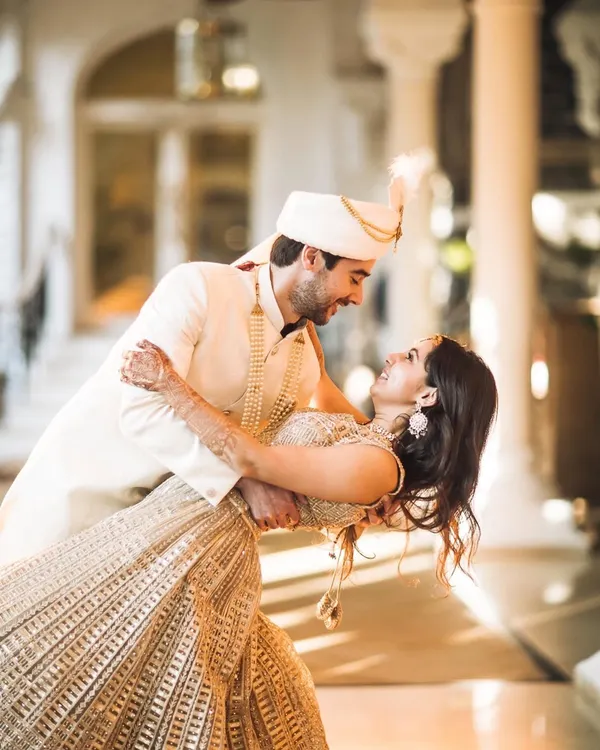 A fairytale moment captured at the Taj Palace Hotel. I love creating these dynamic, joyful shots that show the pure happiness of a celebration. This is about capturing the movement, the laughter, and the beautiful connection between two people.