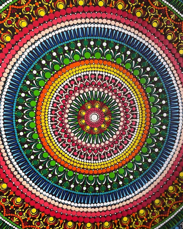 A full view of the 24-inch dot mandala. This piece was a labor of love, with every single dot carefully placed to create the layers of color and pattern. It's a great example of a large-scale commission I can create.