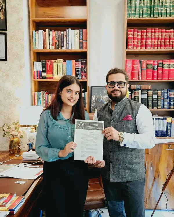 Presenting a certificate of completion to Ms. Aayushi from ICFAI Law School Dehradun. Our internship program provides hands-on experience in real-world legal cases.