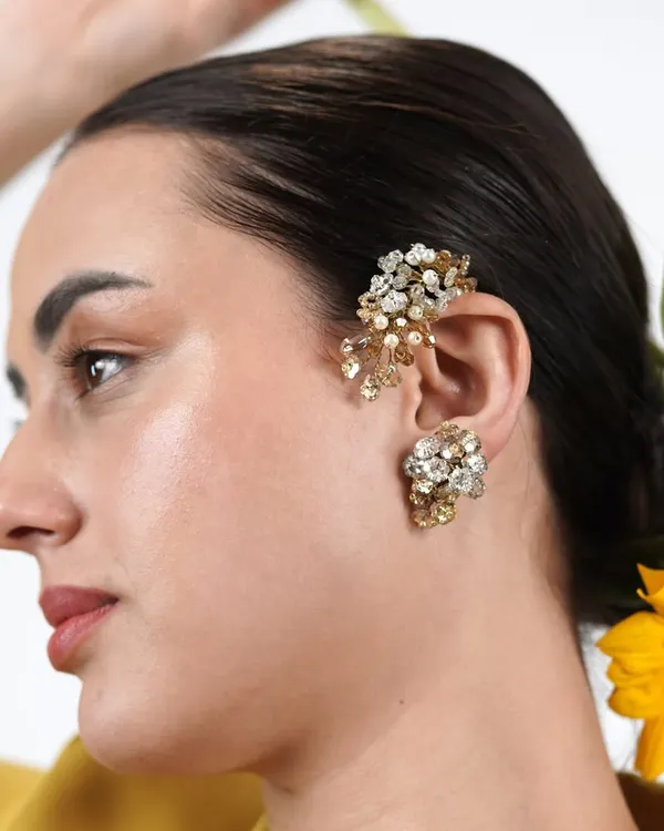 Why wear boring earrings when you can have a classic earcuff? This model shows how our bestselling crystal and pearl earcuff adds an instant touch of glamour and edge to her look.