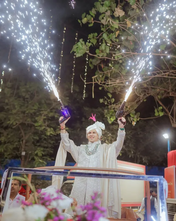 AARYAN KI BARAAT! The groom makes a spectacular entrance, standing in a jeep with cold pyro guns, ready to bring the energy. This is the kind of banger baraat I deliver.