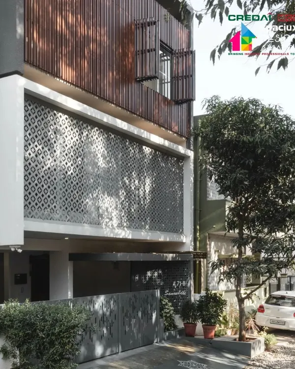 Our '10x10 Residence' project, recognized for its innovative approach to compact residential architecture. The facade features a modern interpretation of a traditional jaali, creating a dynamic play of light and shadow.