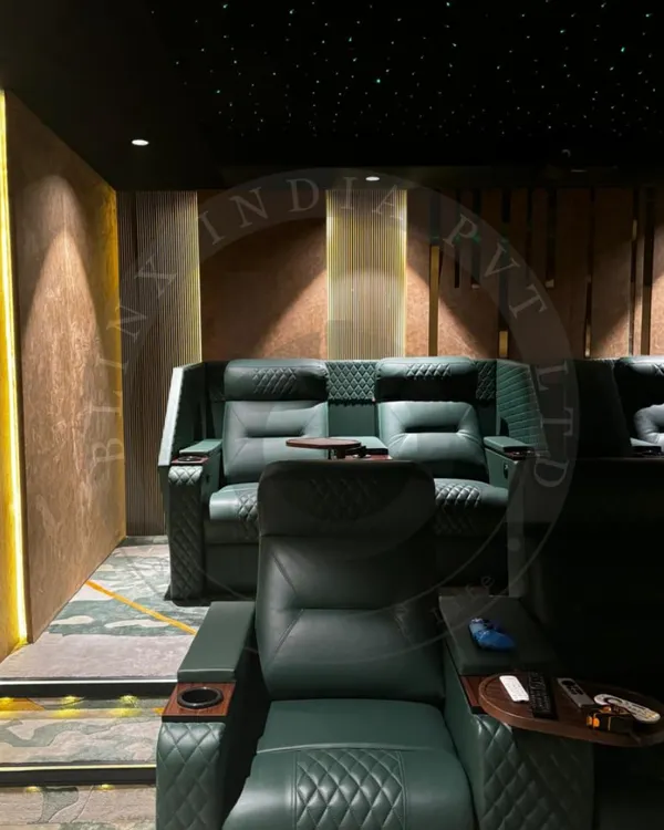 This is the pinnacle of home entertainment. We designed this private cinema with every detail in mind, from the custom-quilted green leather recliners to the immersive fiber optic star ceiling. The layered architectural lighting creates a warm, inviting ambiance, setting the stage for a truly cinematic experience.