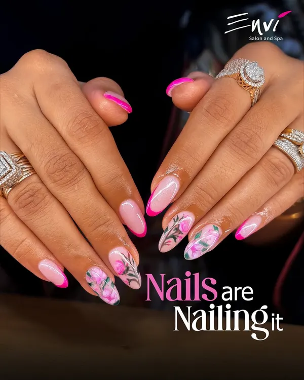 When your nails are this good, you can't help but feel confident. This look features a chic French manicure with a hot pink twist and delicate floral art on an accent nail, creating a fun yet sophisticated style.