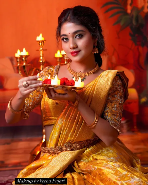 Let's celebrate Deepavali by spreading joy and light. A festive look for the beautiful Manvitha, captured in the warm glow of diyas.