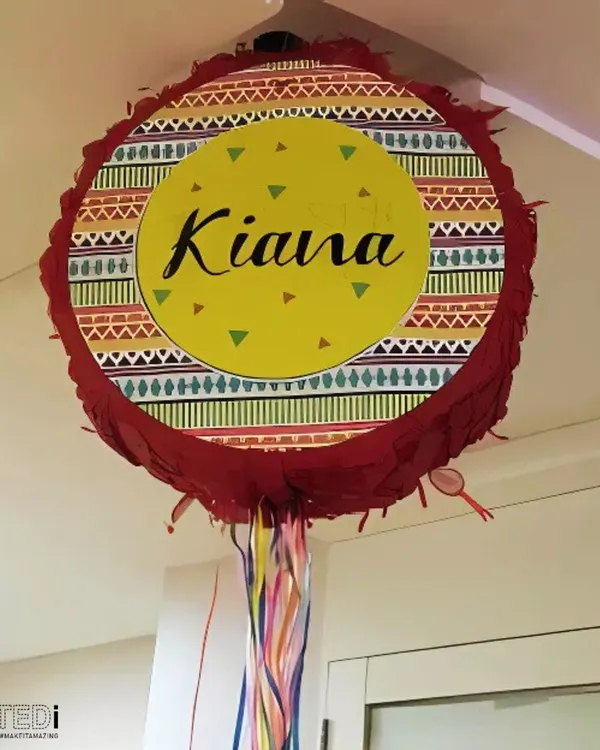 A custom-made piñata for Kiana's party, ready to be filled with candy and surprises. I can personalize these for any name, theme, or occasion.