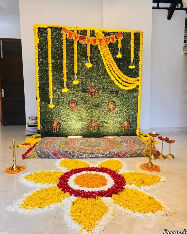 I believe in making every first moment magical. This traditional Annaprashan ceremony setup, complete with a lush marigold backdrop and an intricate floral rangoli, was designed to create a space full of blessings and beauty for a baby's first taste of food.