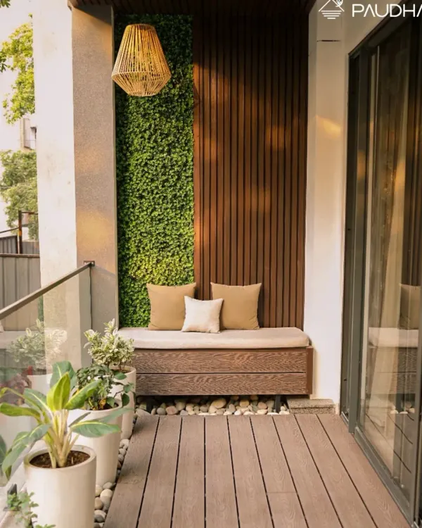 This is what I mean by making a small space a big statement. I designed this cozy balcony nook with a custom-built bench against a backdrop of vertical greenery and warm wood paneling. The weatherproof decking and woven pendant light create a serene, eco-chic vibe, perfect for your morning coffee or evening relaxation.