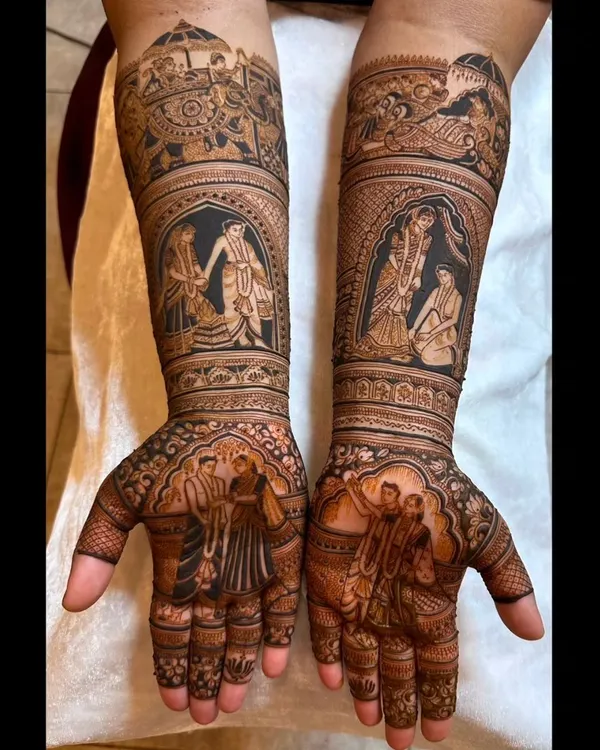 This full-arm bridal design is a canvas for this couple's story, featuring multiple vignettes from their wedding ceremonies, including the varmala and pheras, rendered with incredible detail.