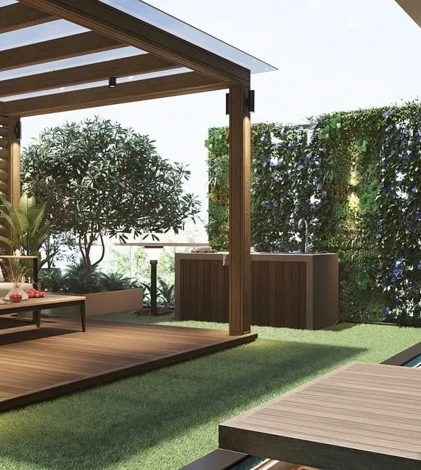 This landscape design for a Khar apartment terrace shows how we integrate relaxation and entertainment. The wooden pergola, comfortable seating, and a lush vertical garden wall come together to create a complete urban oasis.