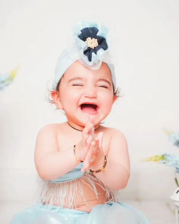 That pure, joyful laugh is everything! My studio is designed to be a fun space where babies feel comfortable enough to show off their true personalities.