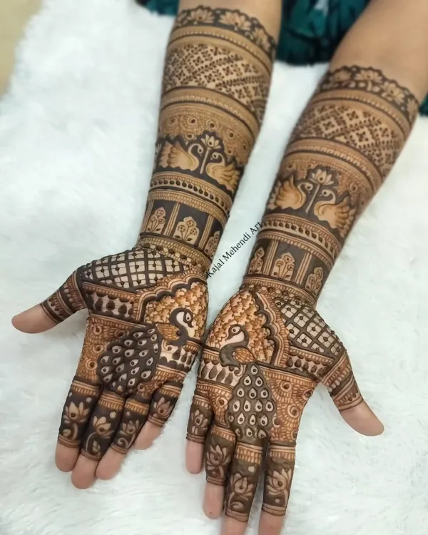 This is the kind of intricate, full-arm bridal mehndi I love to create. Every element, from the delicate peacocks to the fine jaali work, is drawn with care using my own organic henna to celebrate your special day.