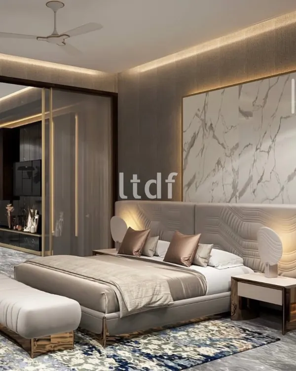 We believe a minimal palette reinforces architectural legibility. This bedroom is a controlled composition where volume and proportion drive the design. The marble panel and sculpted headboard act as the visual anchor, while secondary elements remain deliberately recessive.