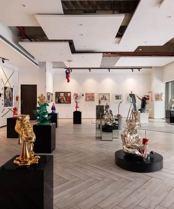 A wide view of our gallery, designed with an open floor plan to allow each artwork room to breathe. The arrangement of sculptures and wall art creates a journey for the viewer, with conversation starters at every turn.