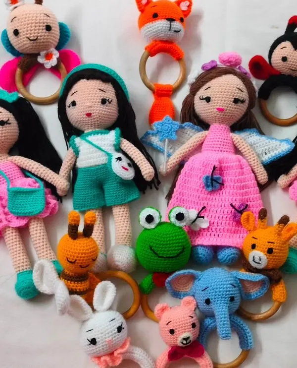 Here is a happy family of my handmade crochet toys. I have dolls and many animal rattles like frogs, bunnies, and elephants. It makes me so happy to see them all together before they go to their new homes.