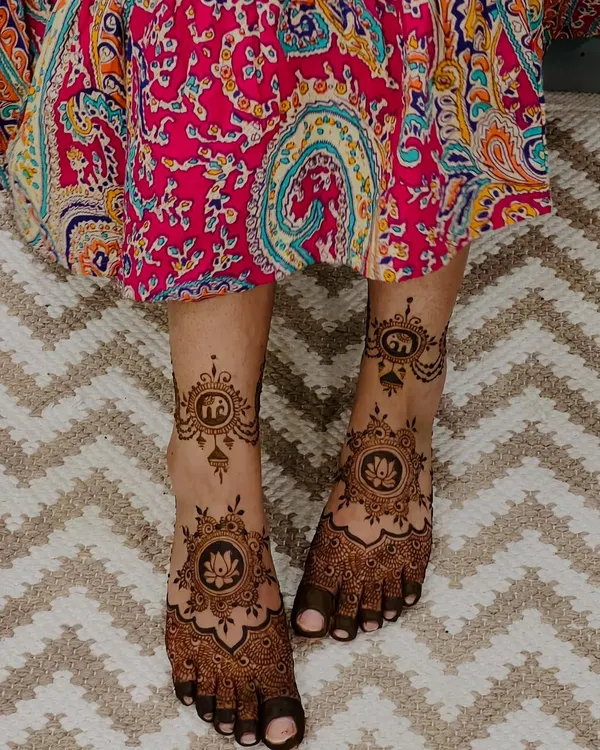 A stunning bridal feet design featuring elephant and lotus motifs. The details are focused on the top of the feet, leaving the sides open for a balanced look.