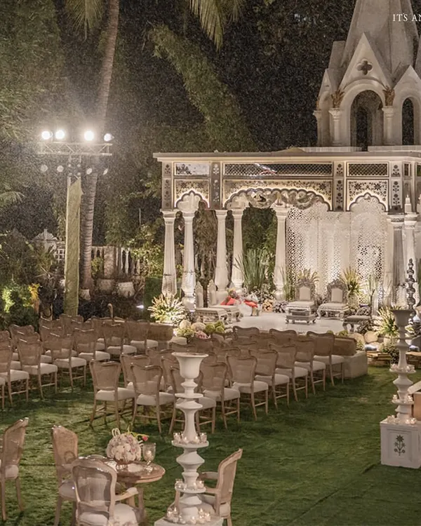 An enchanting night ceremony at the iconic Birla House in Mumbai. The mandap, inspired by heritage architecture, is illuminated against the night sky, creating a magical and timeless atmosphere for an intimate wedding.