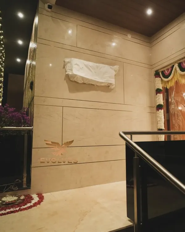 The entrance to a house warming event we decorated. We use a combination of traditional floral arrangements and modern lighting to create a warm and inviting atmosphere.