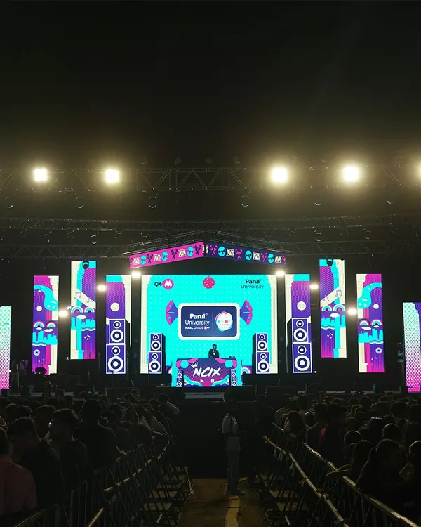 On stage at Parul University, facing a sea of people. The scale of this event shows my experience in handling massive concert crowds and large productions.