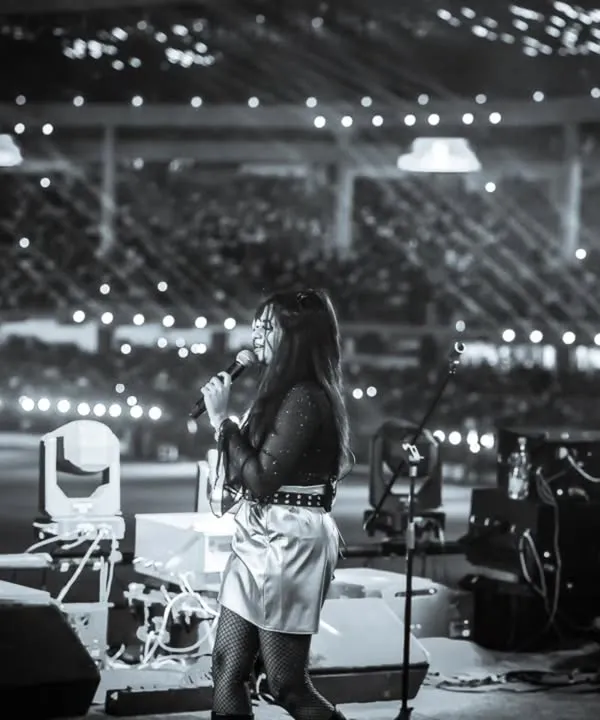 A black and white moment from the RCB Unbox stage. In front of thousands, I felt the collective energy of the crowd, a truly unforgettable experience for any live performing artist.