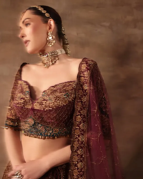 This look is all about regal elegance for a wedding campaign. I styled this deep maroon embroidered lehenga with a statement polki choker and matha patti to create a complete, breathtaking bridal look.