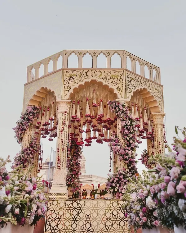 A breathtaking, intricately carved mandap set against the iconic Taj Mahal Palace. We worked with our decor partners to create a structure that felt both grand and divinely beautiful.