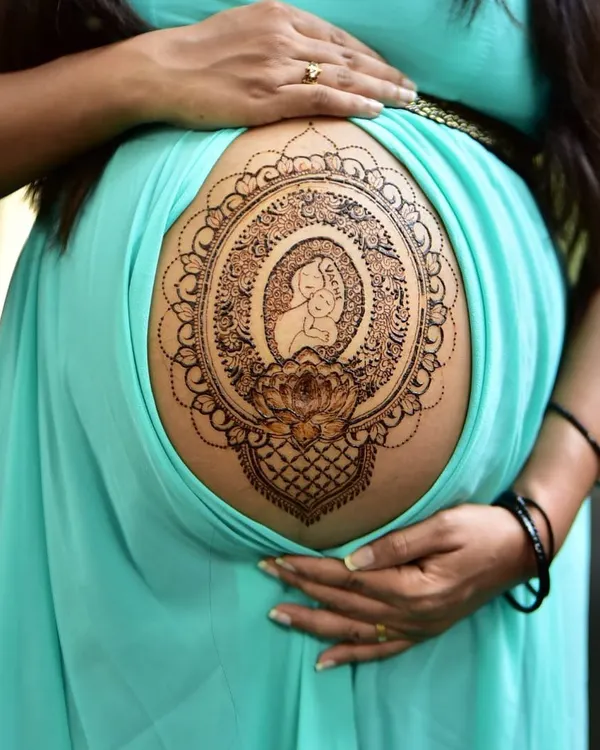 A special blessing for the mom to be. This pregnancy belly henna features a mother and child silhouette inside an intricate mandala frame, created with my all natural, organic paste that is completely safe for you and your baby.