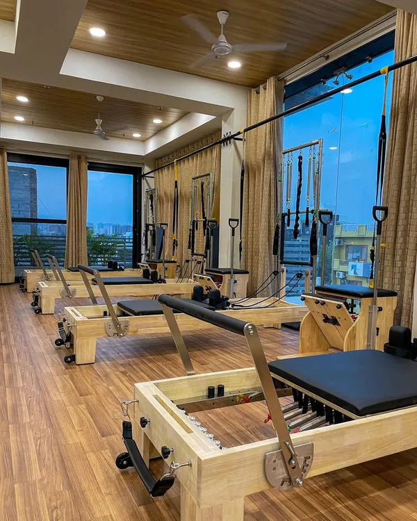 Our studio is filled with natural light and equipped with multiple Pilates reformers, creating a serene atmosphere for your workout.