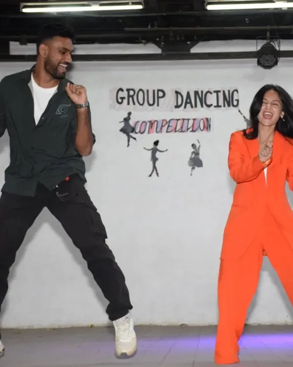 This is what we're all about. We don't just sit and judge; we live the energy of the competition. Here we are, caught in a spontaneous moment of dance during the Group Dancing Competition at St. Anne's High School, bringing our own 'josh' to the event.