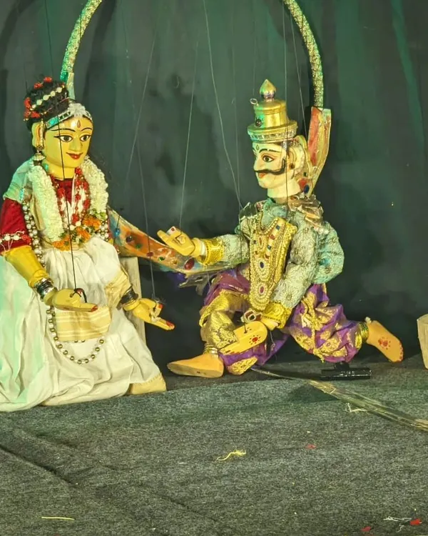 This is the essence of our craft. Two traditional string puppets, brought to life on stage, enact a scene from one of our classical Indian stories. Notice the detailed costumes and expressive features, each designed to convey deep emotion and narrative.