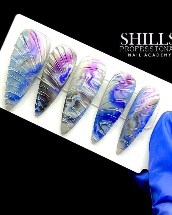 A stunning marble ink design with a textured, wet-look finish created using silver gel lines over a blue, purple, and grey marbled base.