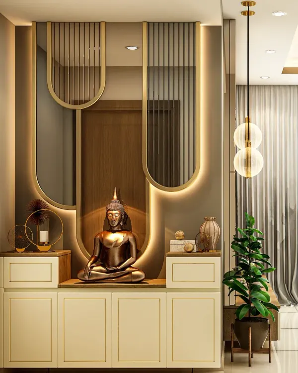A modern and elegant pooja unit designed for a niche space. The design features a serene Buddha statue, backlit panels with intricate mirror work, and integrated storage cabinets below.