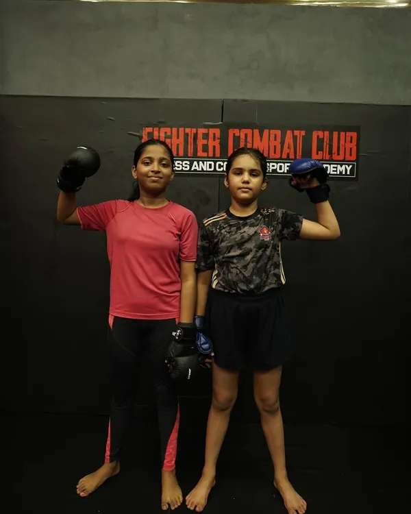 Two of our young female warriors, geared up and ready to train. We instill a mindset of strength and fierceness in all our students, teaching them they are unstoppable.