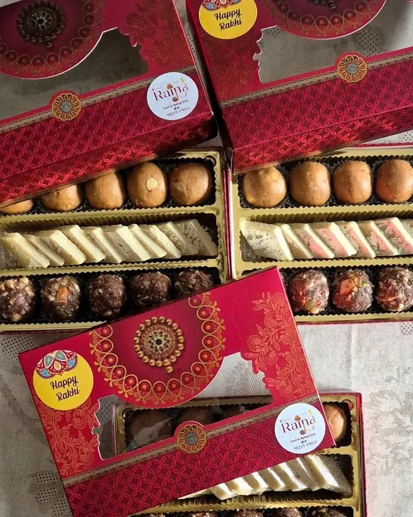 My assorted sweet boxes with "Happy Rakhi" stickers, ready for the festival. Gifting fresh, homemade sweets is a wonderful way to show you care.