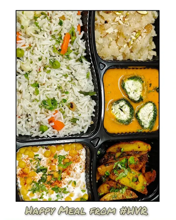 A complete and satisfying 'Happy Meal' featuring my special Palak Paneer Kofta, vegetable pulao, boondi raita, masala aloo, and a sweet dry fruit sheera.
