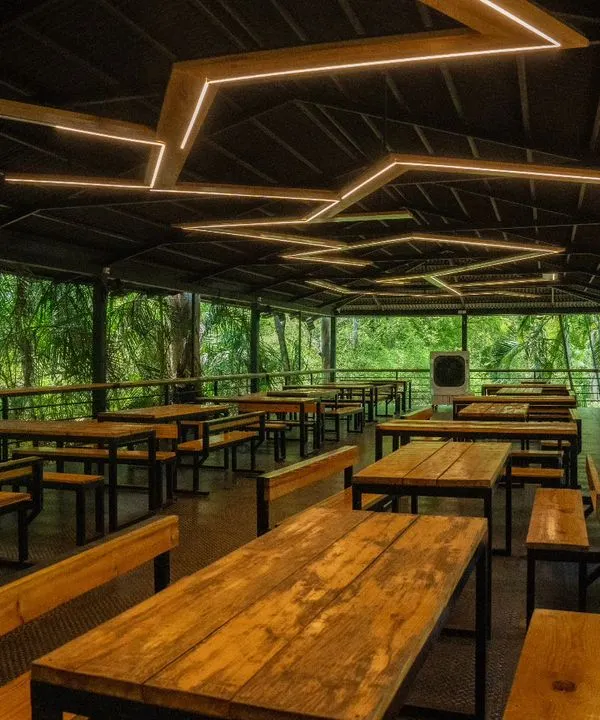 Our dining hall is designed to keep you connected with nature, with open walls that look out into the forest. It's the perfect setting to enjoy our buffet.