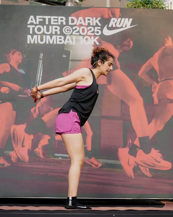 Leading a yoga session for the Nike After Dark Run Tour in Mumbai. It's always powerful to guide a large group, sharing the importance of stretching and mobility for runners.