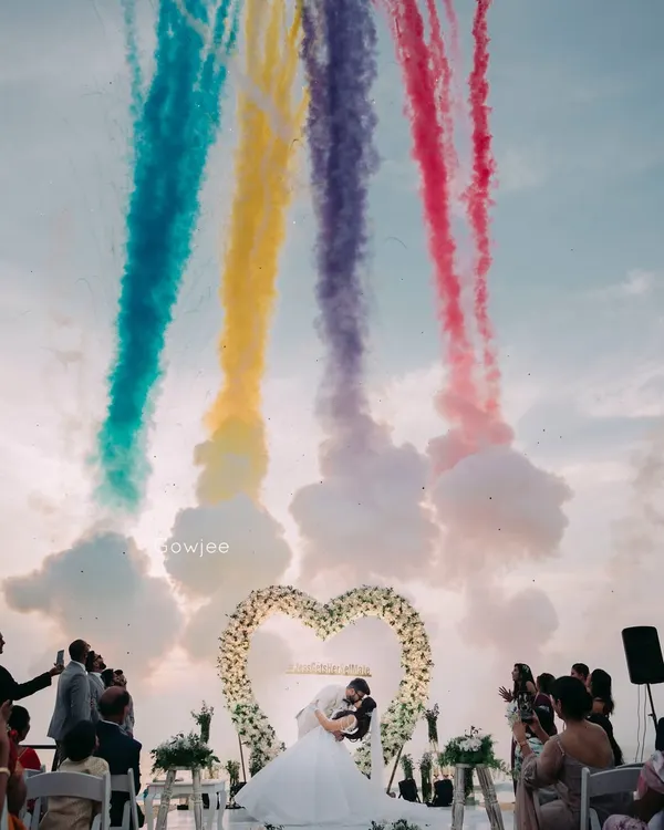 A fairytale moment for the couple, framed by a floral heart and celebrated with a spectacular burst of color in the sky. I love creating these jaw-dropping highlights for your big day.