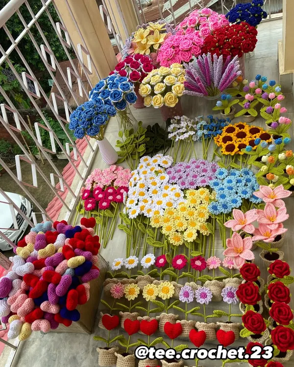 A vibrant overview of a large custom order, featuring a colorful assortment of my handmade crochet flowers and amigurumi, ready for a client. This shows the variety I can handle in a single bulk order.