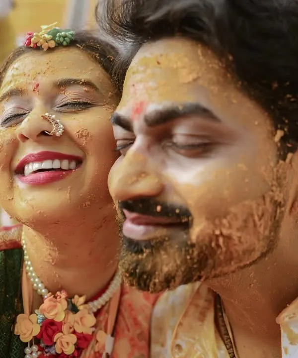 Pure, unadulterated joy! This is what a Haldi ceremony is all about. We love capturing these close-ups where the couple is just lost in laughter and covered in turmeric.