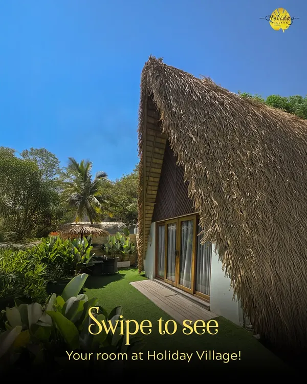 Your room at Holiday Village awaits. This view of our A-Frame cottage shows the private entrance and personal green space that makes your stay feel exclusive and serene.