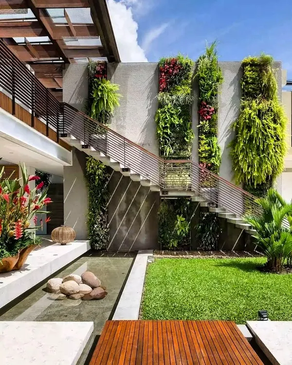 We integrated vertical green panels along the exterior staircase of this modern South Indian villa, turning a simple wall into a living, breathing part of the architecture. This is how landscaping becomes art.
