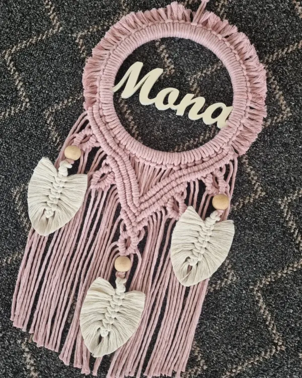 A name etched in time. This dusty rose macrame wall hanging, personalized with the name 'Mona', is a beautiful symbol of love and makes for a treasured personal gift.