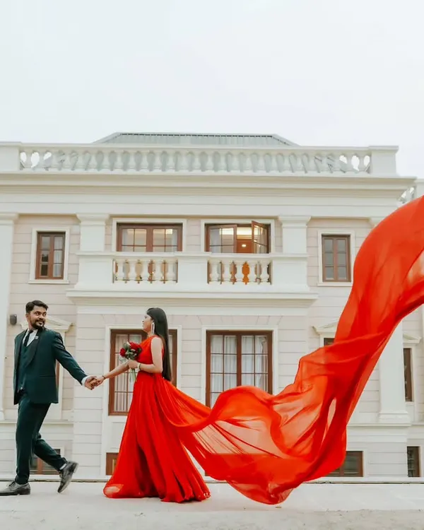 A fairytale moment captured against a grand backdrop. I love creating these epic shots where the flowing gown and stunning architecture come together to tell a story of modern royalty. This is for couples who dream big.