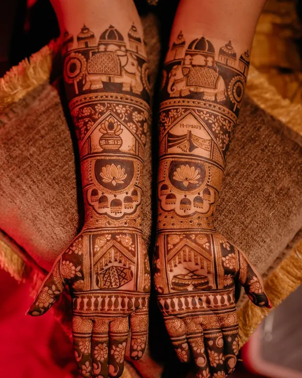 A classic bridal design crafted with traditional elements like elephants, dhol (drums), kalash (pots), and wedding knots. This regal design is rich in symbolism and beauty.